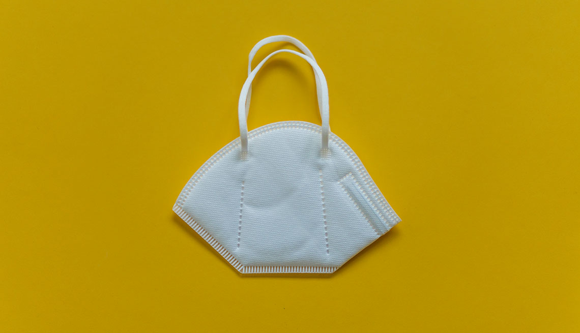 n95 mask on yellow background