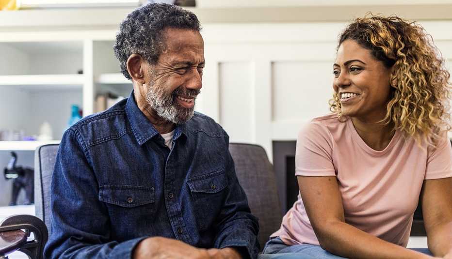 An older man and a younger woman are talking