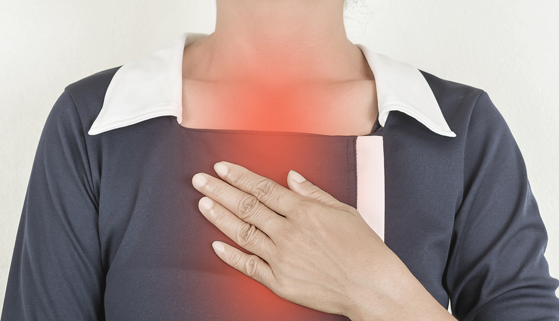 A woman with painful heartburn