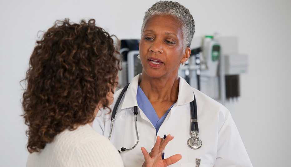 doctor talking to a female patient