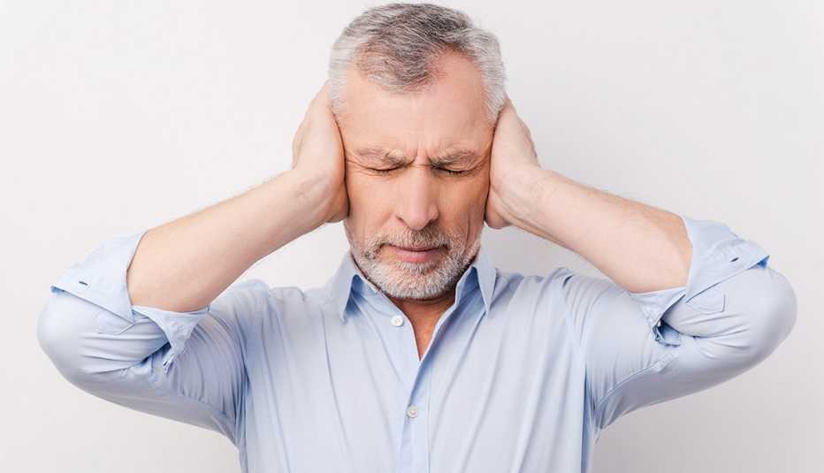 man in shirt holding head in hands and keeping eyes closed man in shirt holding head in hands and keeping eyes closed