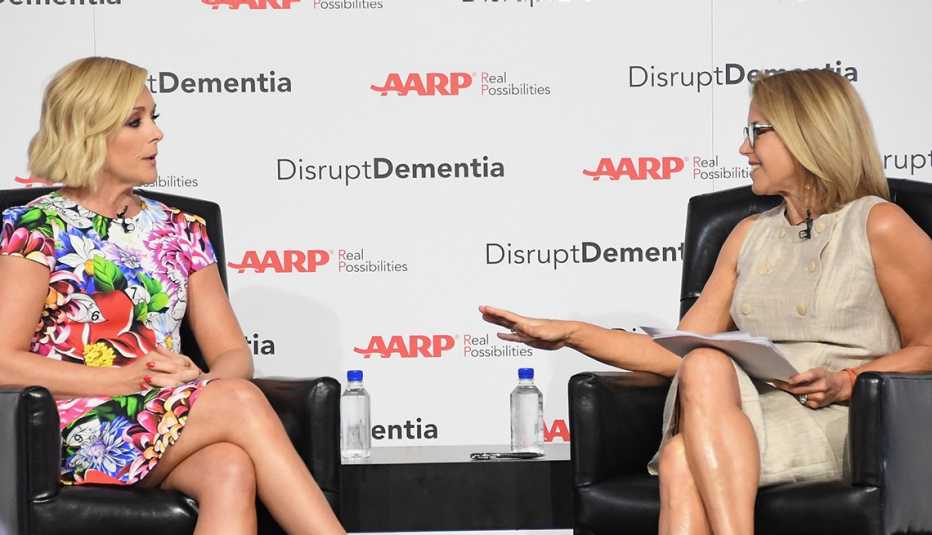 Actress Jane Krakowski sitting across from interviewer Katie Couric. Backdrop says: AARP: Disrupt Dementia. Actress Jane Krakowski sitting across from interviewer Katie Couric. Backdrop says: AARP: Disrupt Dementia.