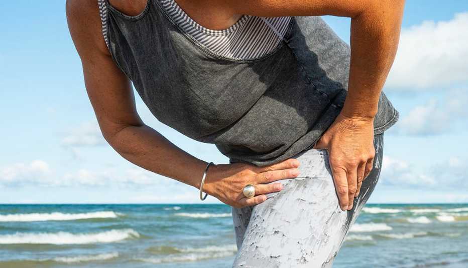 woman holding hip