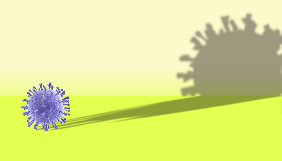 a coronavirus germ cell casting a very long shadow that looms over it