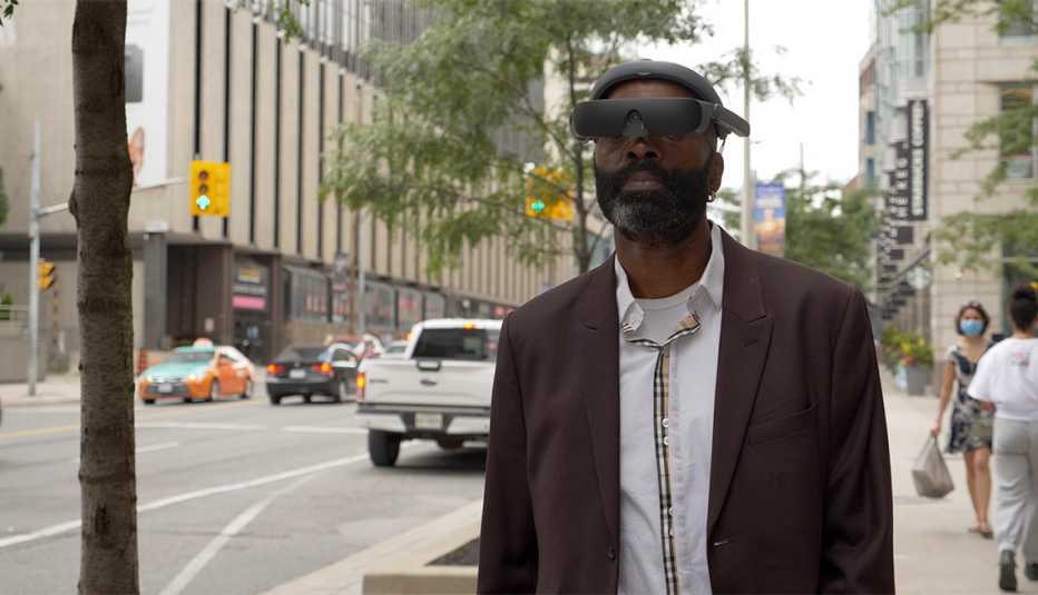 Person walking with eSight assistive vision device