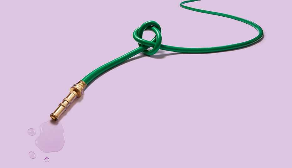 leaking garden hose with a large knot tied in it as a symbol for a prostate problem