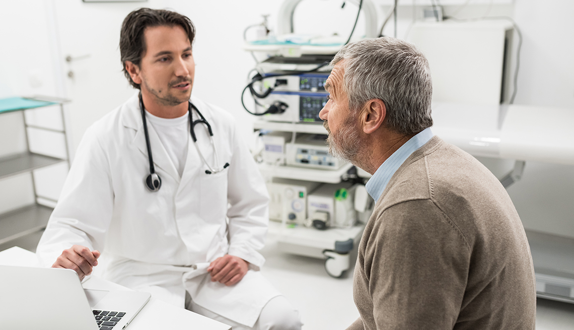 A male patient is having a consultation with doctor in office