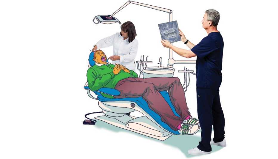 a dentist reviews x-rays of a patient a dentist reviews x-rays of a patient