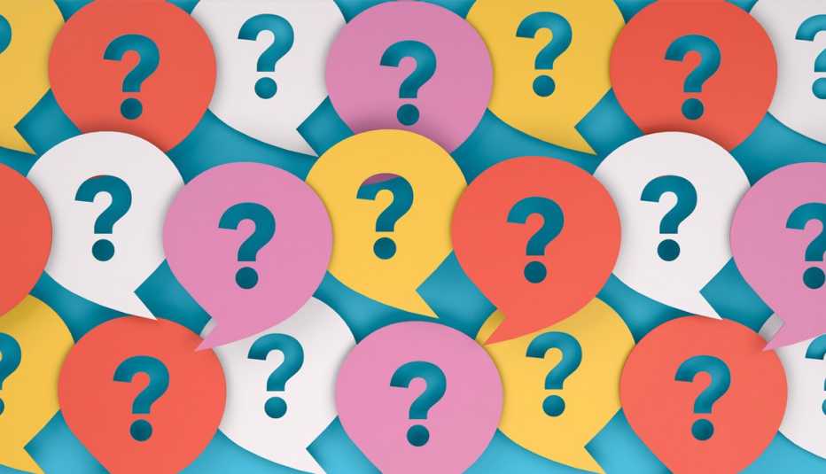 paper cut outs of word bubbles with question marks cut out of them