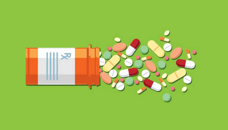 prescription pill bottle open with an assortment of different kinds of pills and capsules spilling out
