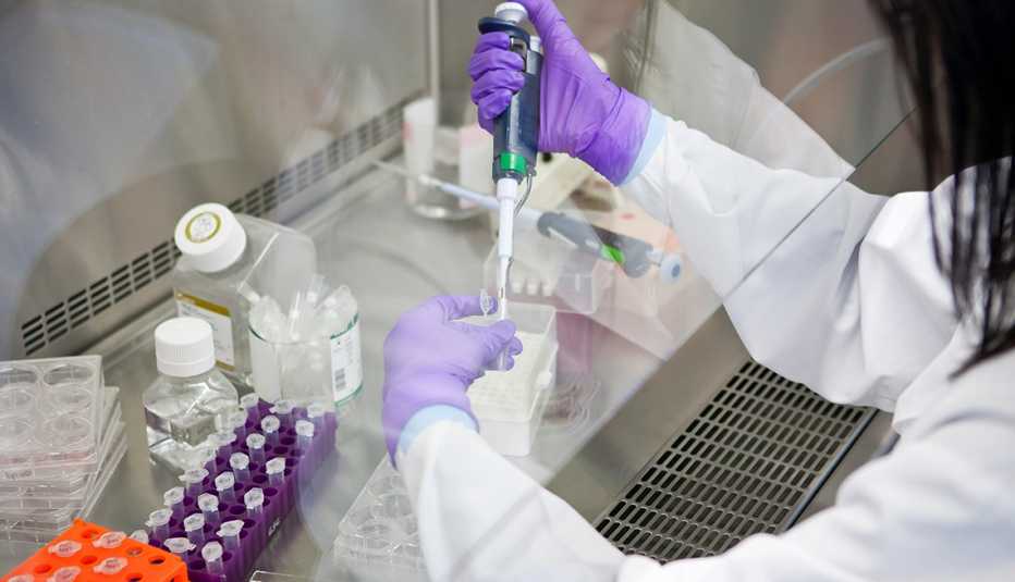 scientist using a micro-pipette