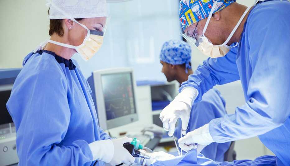Surgeons performing surgery
