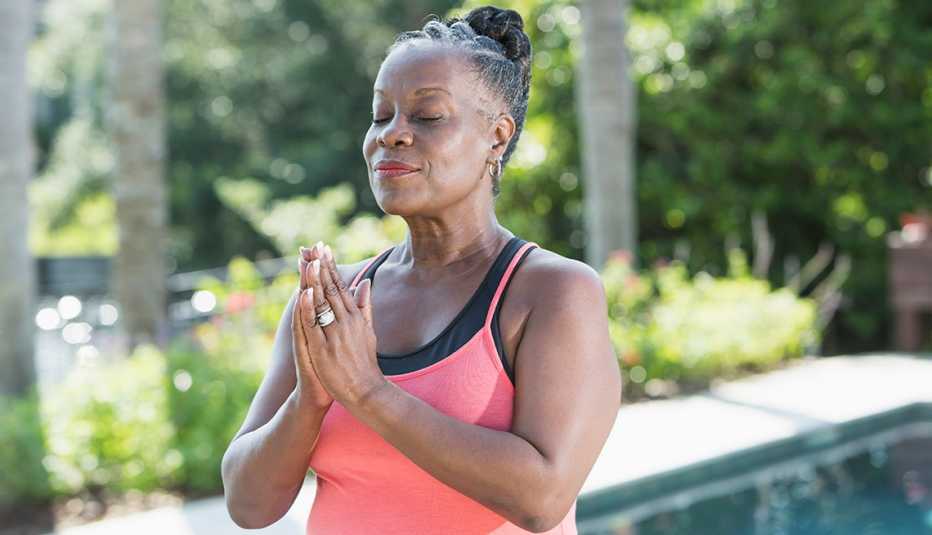 a woman meditating outside