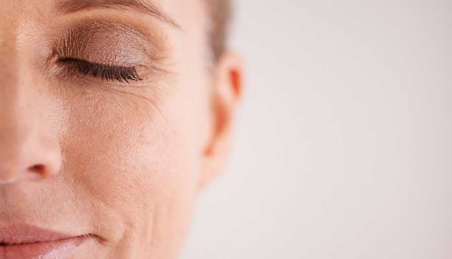 Closeup of a woman wearing eye makeup.