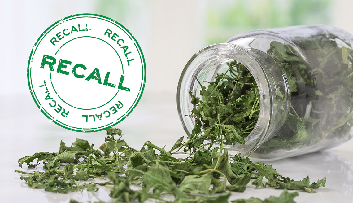 an opened jar of dried parsley sits next to a food safety type of recall sign