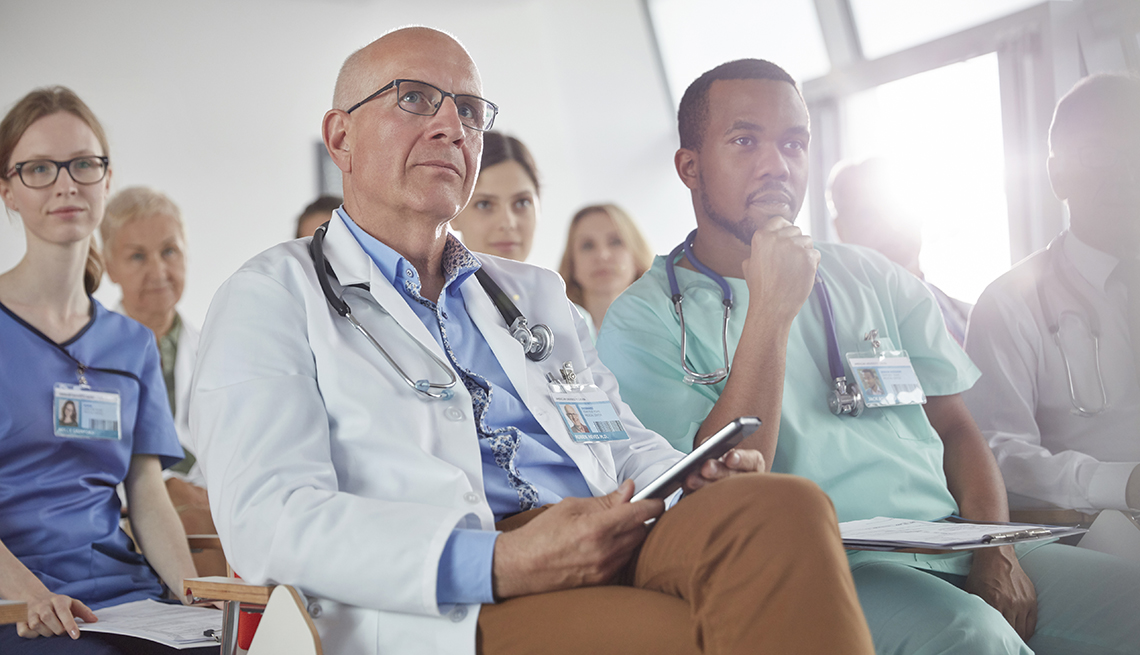 Doctors and surgeons in a meeting