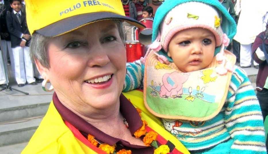 shirley griffin holding a baby and smiling