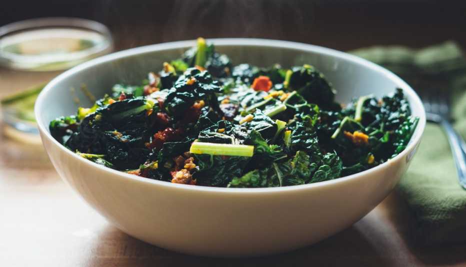a bowl of spinach salad a bowl of spinach salad