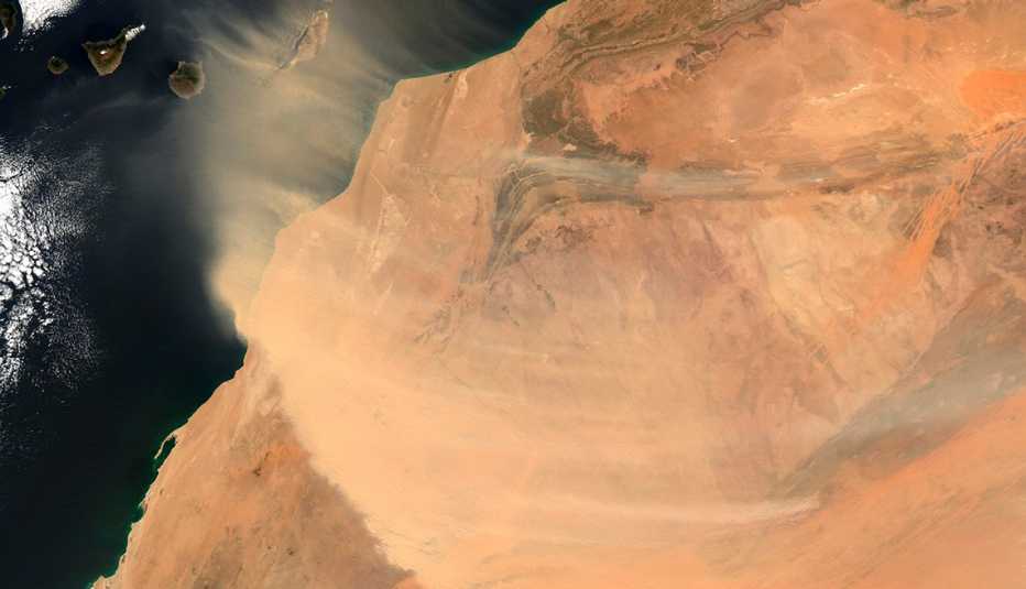 satellite image from over africa showing a sand dust cloud sweeping west over the atlantic ocean