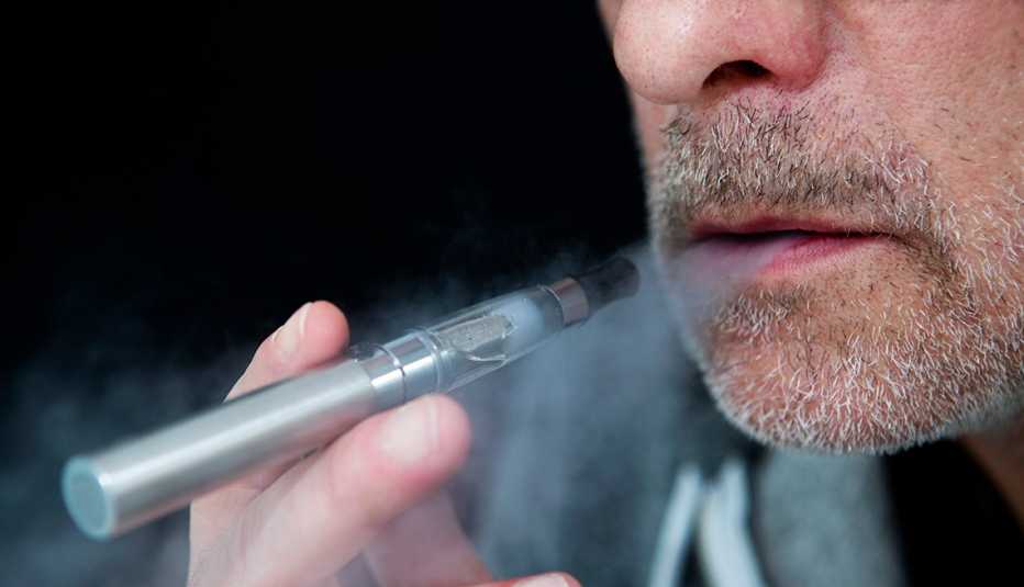 A man smoking an electronic cigarette