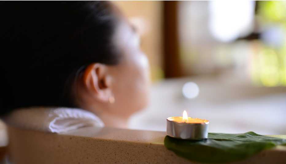 Woman relaxing in a bathtub