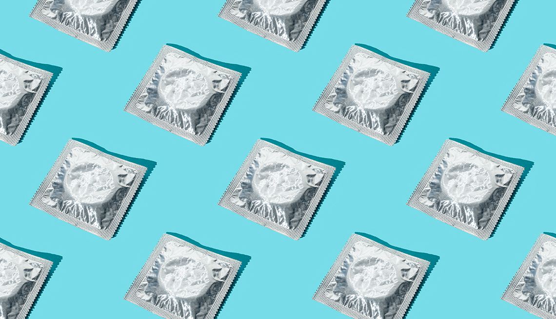 rows of packaged condoms in silver wrappers