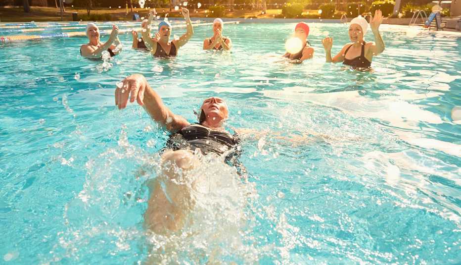 People swimming in a pool People swimming in a pool