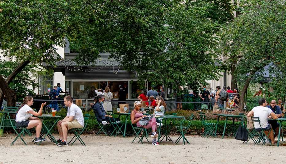 People dine outdoors at Shake Shack in Madison Square Park during the fourth phase of the coronavirus reopening on August 12, 2020 in New York, New York. The fourth phase allows outdoor arts and entertainment, sporting events without fans and media production.