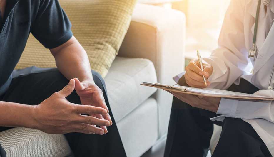 Doctor consulting male patient Doctor consulting male patient