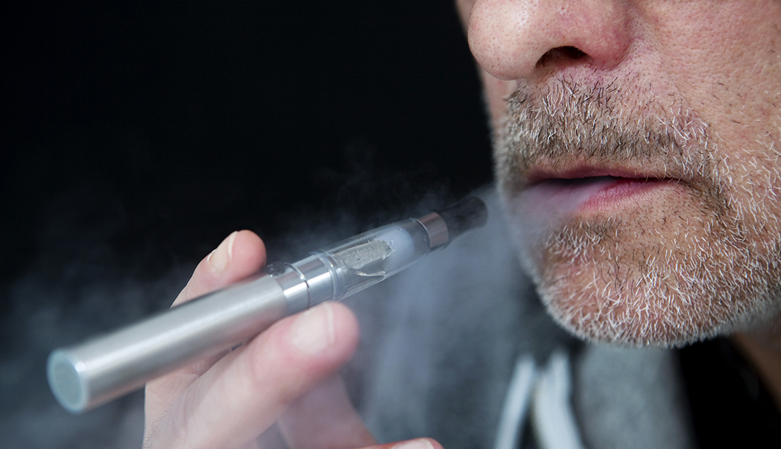 A man smoking an electronic cigarette