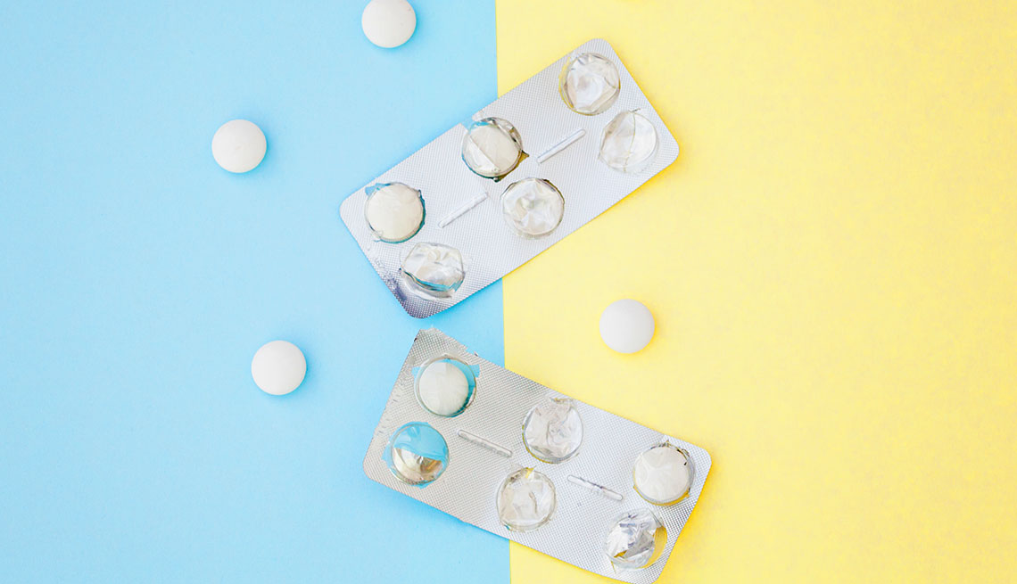 medicine blister in pastel background,blue and yellow