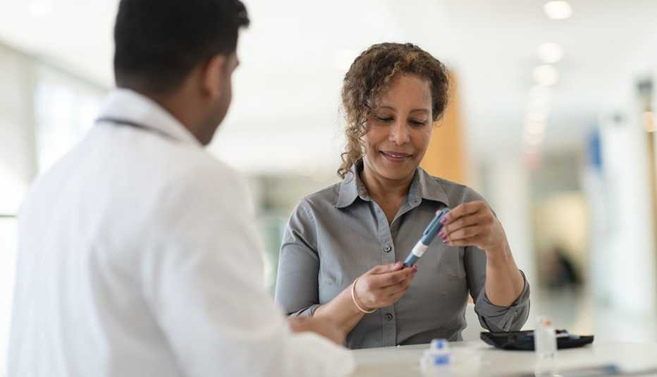 Doctor and patient discussing insulin pen