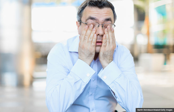 Drowsy man rubbing eyes, Potential risks of using sleeping aids (Martin Botvidsson/Maskot/Getty Images)