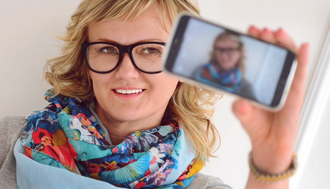 Mature woman takes a selfie photo