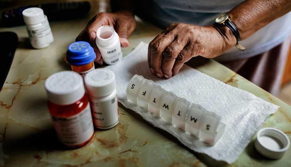 close-up of person sort medications