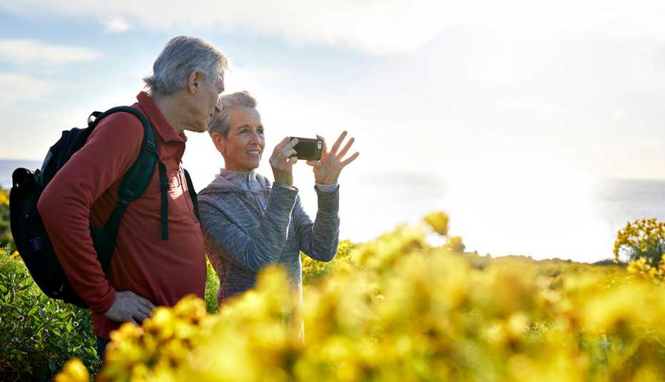 Couple out on a hike and taking photos. Couple out on a hike and taking photos.