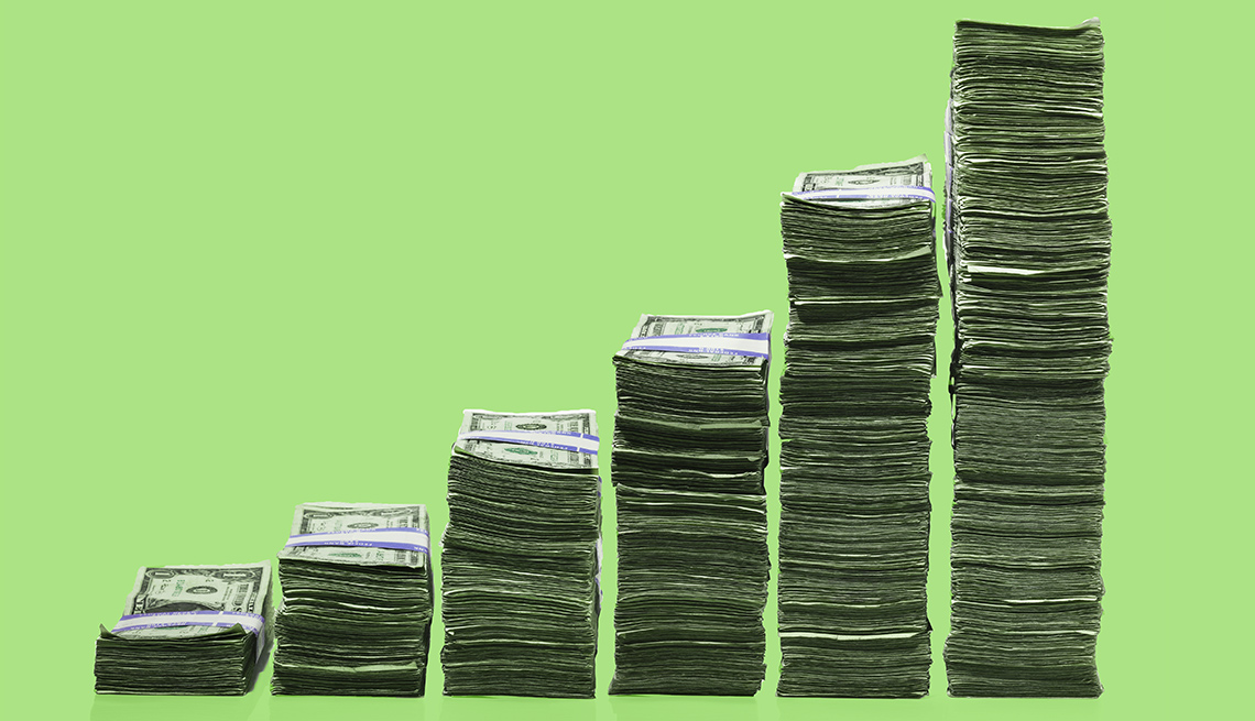 Stacks of dollar bills higher stacks