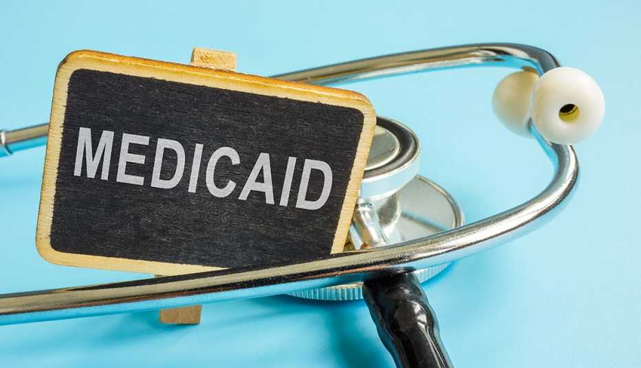 chalkboard with word Medicaid and a stethoscope.