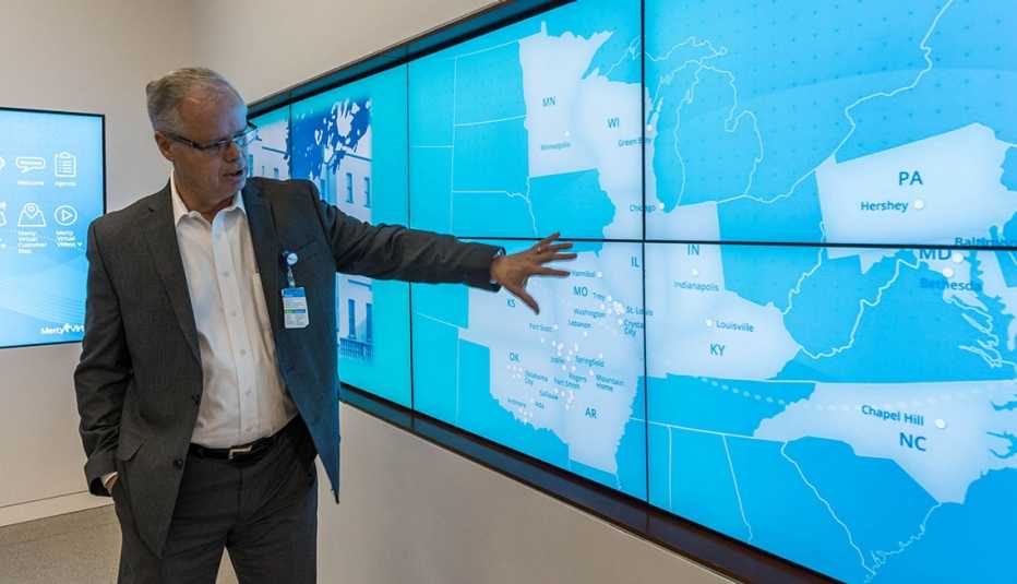 Randall moore pointing at a map 