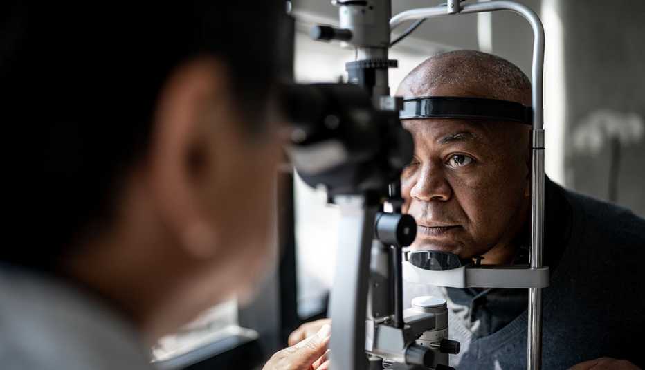 doctor examining patient's eyes