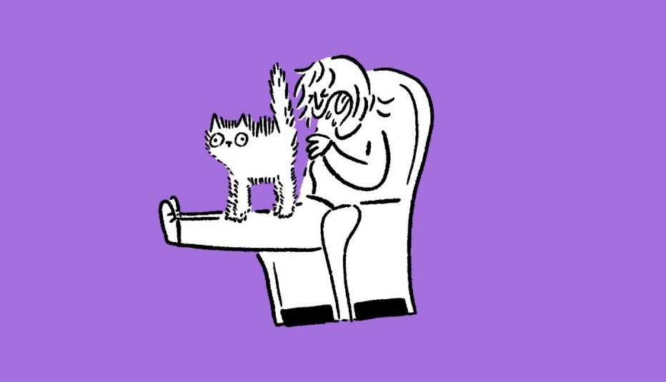 Person sitting on a chair with a cat and coughing.