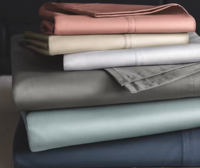 A stack of different color Sleep Number True Temp Sheet Sets