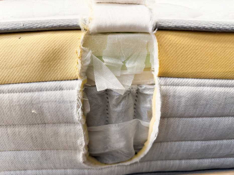 Side of mattress cut open to reveal interior construction