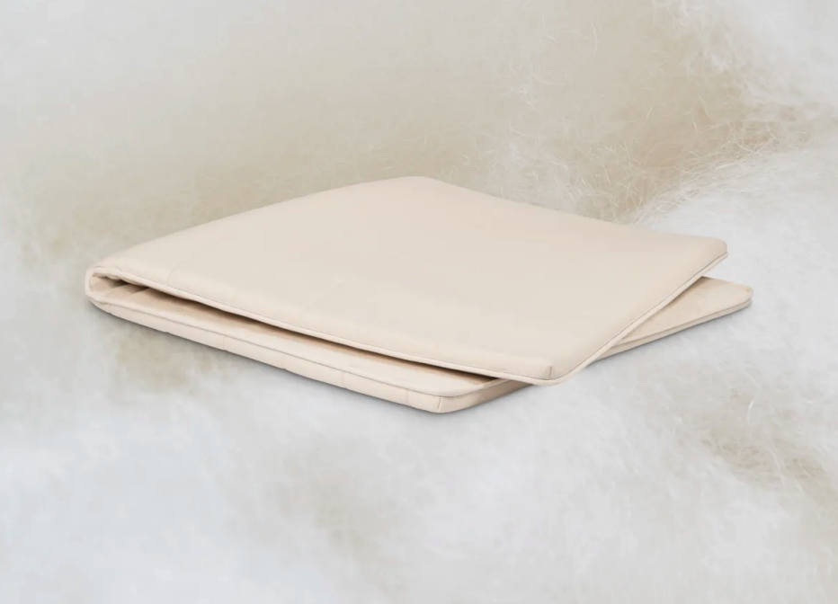 The Birch Plush Organic Topper folded in half