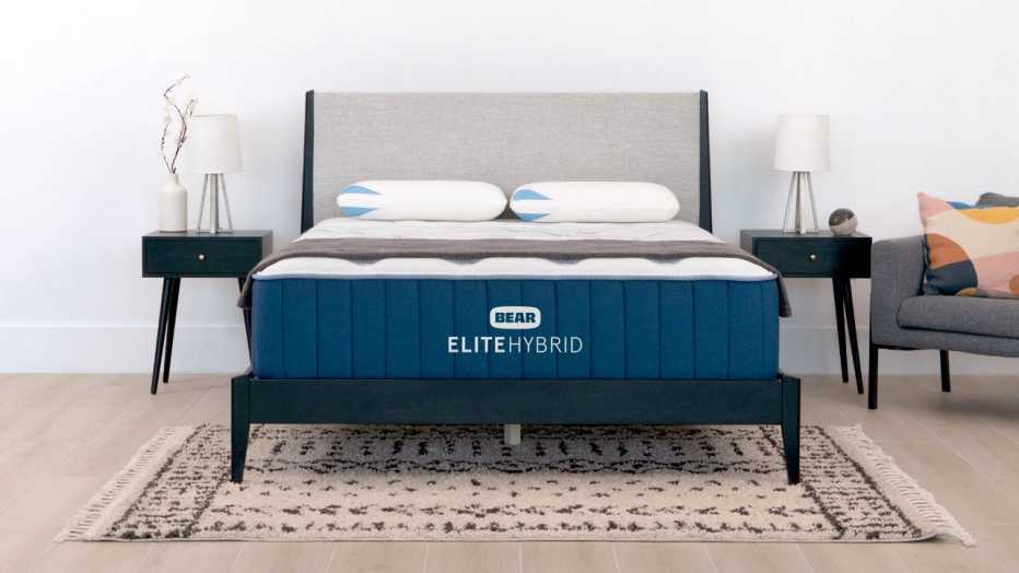 The Bear Elite Hybrid in a bedroom with two nightstands 