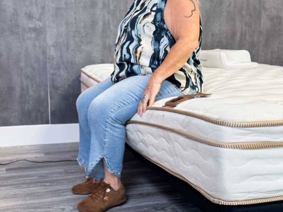 a person sitting on a mattress