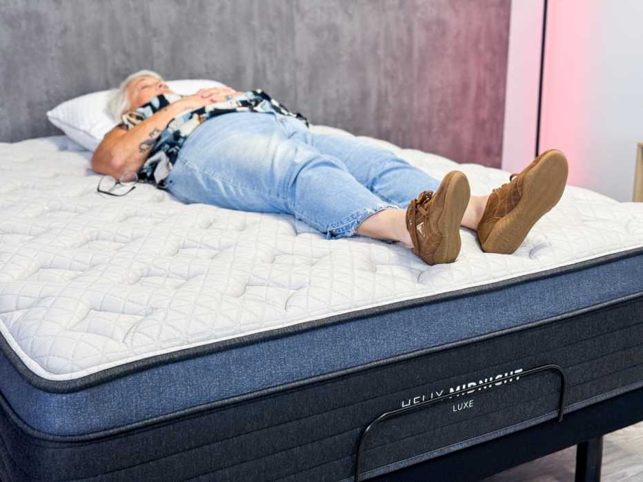 a person laying on a mattress
