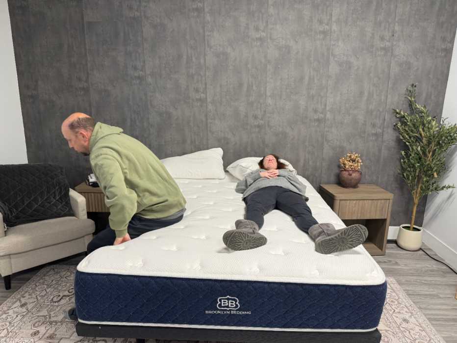 Two people on the Brooklyn Bedding Signature hybrid mattress.