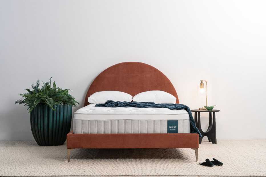 The Leesa Sapira Chill Hybrid mattress on a fabric bed frame
