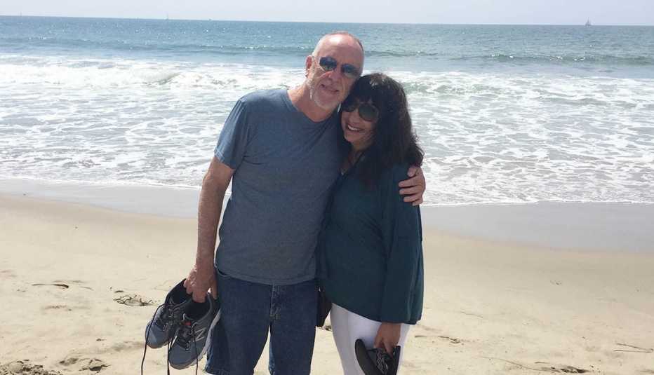 Ann Brenoff with her partner on the beach